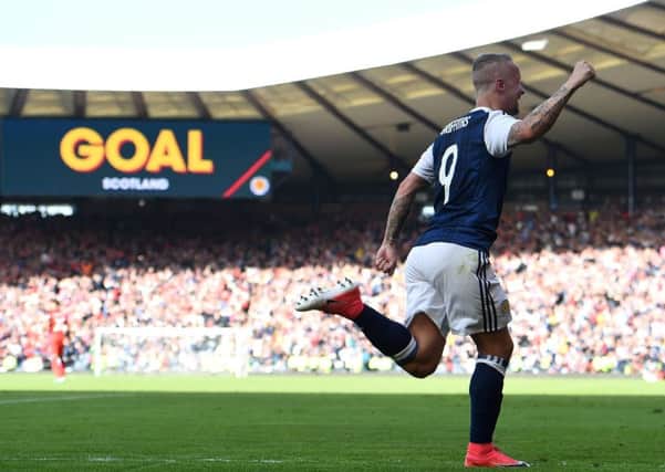 Leigh Griffiths celebrates after scoring Scotland's second goal. Picture: PAUL ELLIS/AFP/Getty Images