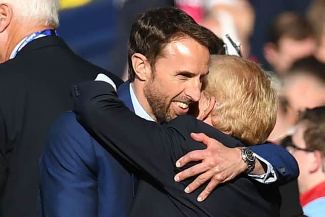 Gareth Southgate gives Gordon Strachan a hug at the end of an emotional game.  Photograph: Paul Ellis/AFP
