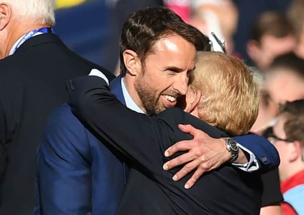 Gareth Southgate gives Gordon Strachan a hug at the end of an emotional game.  Photograph: Paul Ellis/AFP