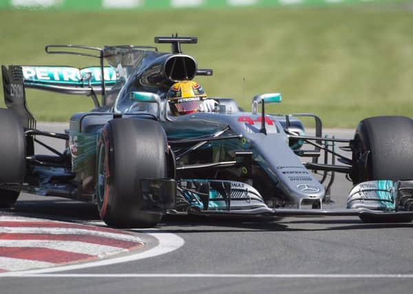 Lewis Hamilton set the fastest lap ever recorded at the Circuit Gilles Villeneuve to make sure he was first on the grid in Montreal. Photograph: Graham Hughes/AP