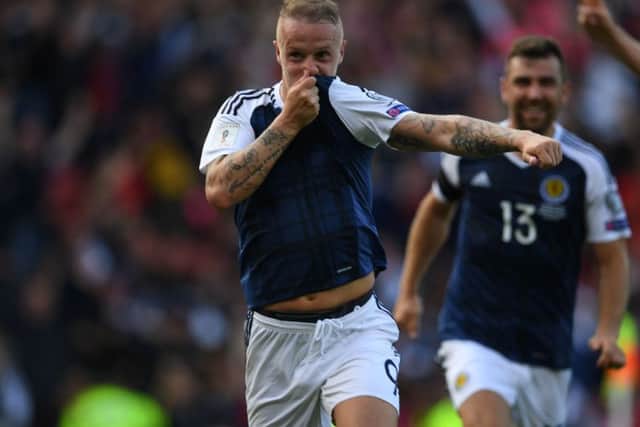 Leigh Griffiths is delighted having put Scotland ahead. Picture: PAUL ELLIS/AFP/Getty Images