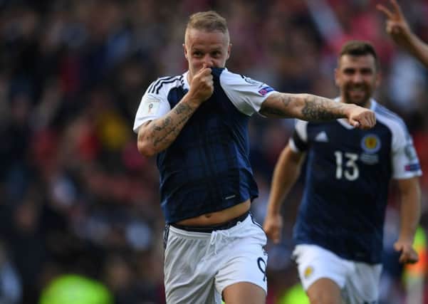 Leigh Griffiths is delighted having put Scotland ahead. Picture: PAUL ELLIS/AFP/Getty Images
