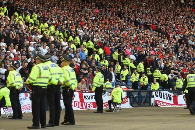 Lines of police separate rival supporters in the crowd. Picture: PAUL ELLIS/AFP/Getty Images