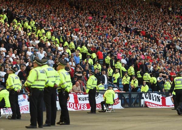 Lines of police separate rival supporters in the crowd. Picture: PAUL ELLIS/AFP/Getty Images