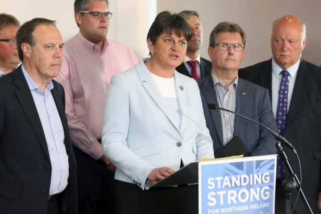 Democratic Unionist Party leader Arlene Foster with her party. (AP Photo/Peter Morrison)