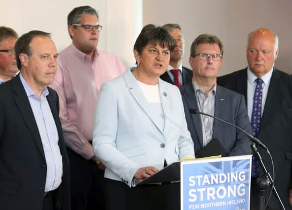 Democratic Unionist Party leader Arlene Foster with her party. (AP Photo/Peter Morrison)
