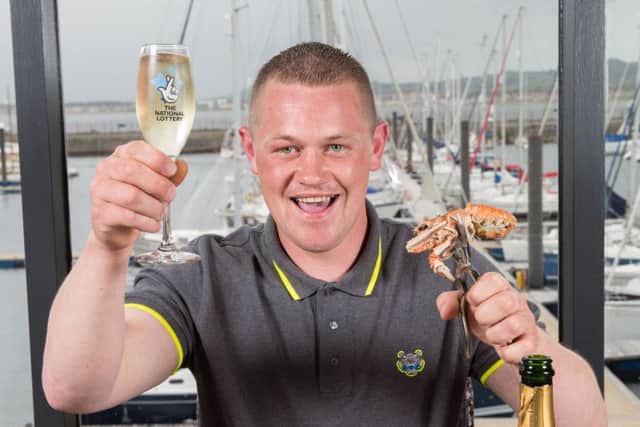 National Lottery Scratchcard winner David Abercrombie (26) celebrating his Â£300,000 win in Troon.