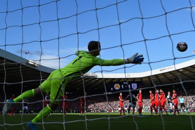 Leigh Griffiths curls a wonderful free-kick past Joe Hart to give Scotland a 2-1 lead against England. Picture: Shaun Botterill/Getty Images
