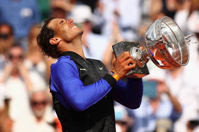An emotional Rafael Nadal celebrates with the trophy after his crushing win over Stan Wawrinka in the French Open final: Picture Clive Brunskill/Getty