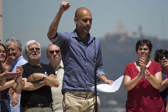 Manchester City coach Pep Guardiola gestures after delivering a speech during a protest organised by the National Assembly for Catalonia, to support the call for referendum in Barcelona. Picture: AP Photo/Emilio Morenatti