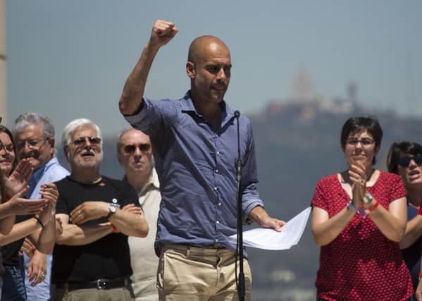 Manchester City coach Pep Guardiola gestures after delivering a speech during a protest organised by the National Assembly for Catalonia, to support the call for referendum in Barcelona. Picture: AP Photo/Emilio Morenatti
