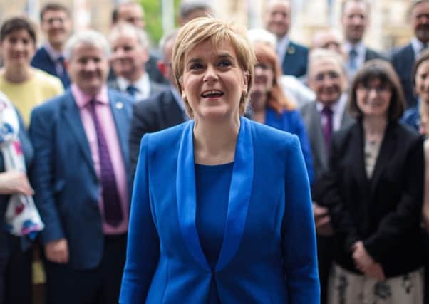Scottish National Party Leader Nicola Sturgeon poses in front of SNP MPs elected in the general election Photo by Jack Taylor/Getty Images
