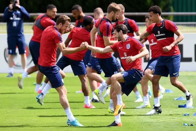 Harry Kane, left, will skipper the England team again in tonights friendly against France. Picture: AFP/Getty.