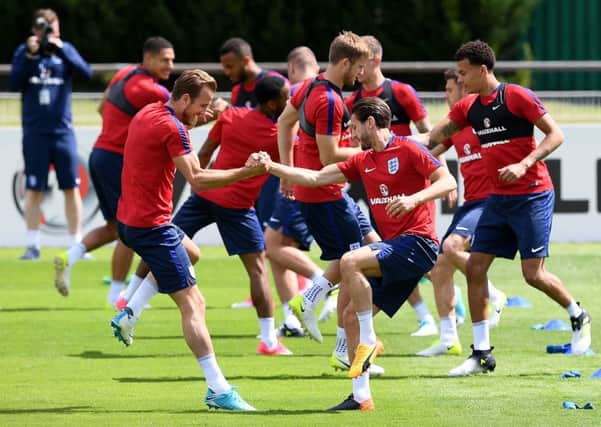 Harry Kane, left, will skipper the England team again in tonights friendly against France. Picture: AFP/Getty.