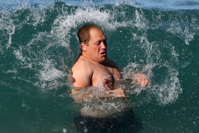 WP Nel is engulfed by a wave during Scotland's recoverysession in the sea off Coogee beach, near Sydney.