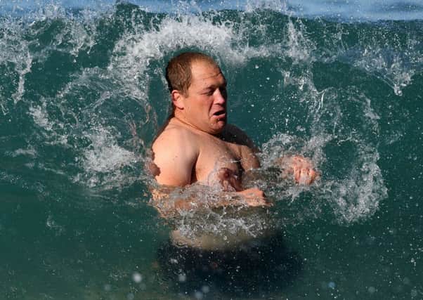 WP Nel is engulfed by a wave during  Scotland's recoverysession in the sea off Coogee beach, near Sydney.