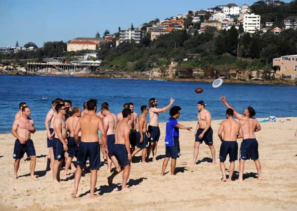 Scotland players stretch off on Coogee beach at the start a recovery session. Picture: Fotosport/David Gibson