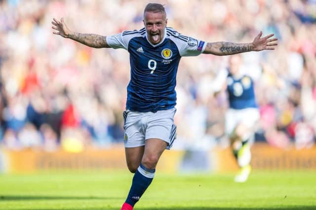 Leigh Griffiths celebrates his first free-kick against England. Picture: SNS/Bill Murray
