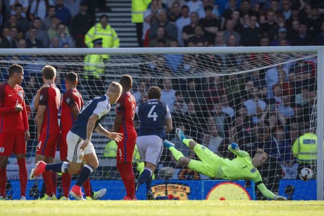 Leigh Griffiths nets his first goal for Scotland. Picture: SNS/Roddy Scott