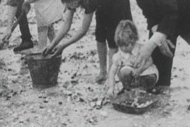 Cocklepicking at Castlebay in the 1950s. Picture: Library of Scotland