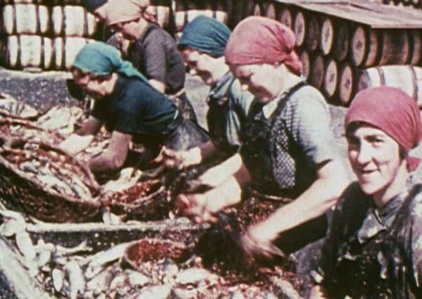 Herring lassies at the quayside in Thurso. Picture: Library of Scotland