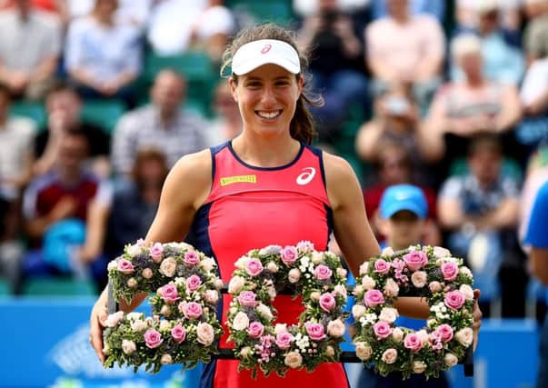 Johanna Konta is presented with a wreath to commemorate her 300th singles career win after her victory over Tara Moore at the Aegon Open Nottingham. Picture: Jordan Mansfield/Getty Images for LTA