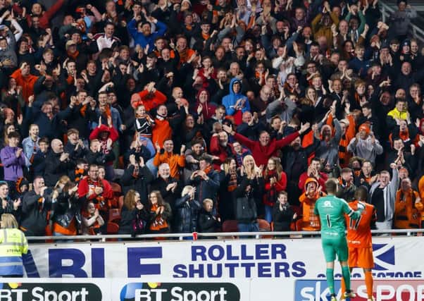 12/05/17 LADBROKES PREMIERSHIP PLAY-OFFS QUATER FINAL
DUNDEE UTD V MORTON
TANNADICE - DUNDEE
Dundee UTD’s wato Kuate (17) celebrates his goal with the fans and team mate Cammy Bell