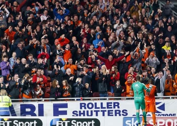 12/05/17 LADBROKES PREMIERSHIP PLAY-OFFS QUATER FINAL 
 DUNDEE UTD V MORTON
 TANNADICE - DUNDEE 
 Dundee UTD&#x2019;s wato Kuate (17) celebrates his goal with the fans and team mate Cammy Bell