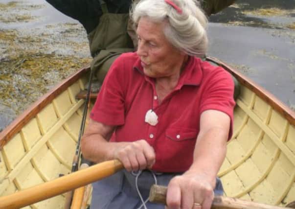 Edith Wild, also known as the Wild Lady of Lochbroom, is pictured rowing on the loch in her early eighties. PIC: Contributed.
