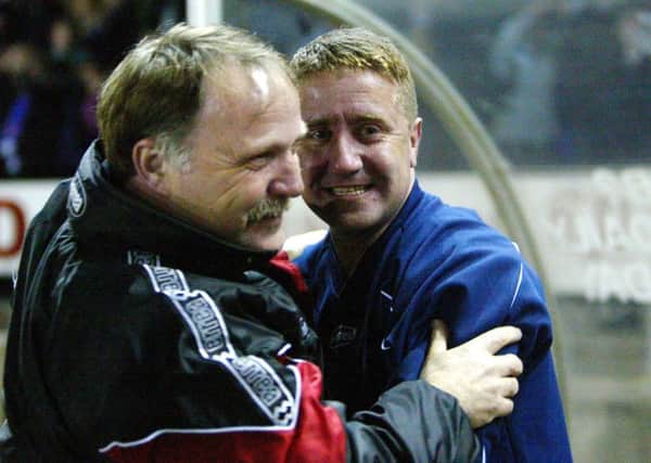 John Robertson celebrates with No2 Donald Park after his Inverness side defeated Celtic in the Scottish Cup quarter-finals in 2003. Picture: PA