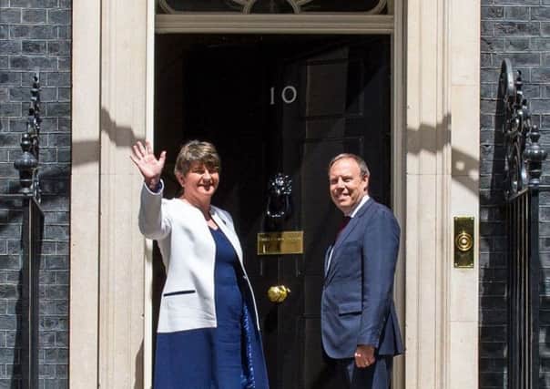 DUP leader Arlene Foster and DUP deputy leader Nigel Dodds arriving at 10 Downing Street. Picture: PA