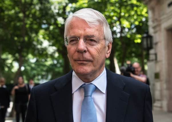 Former prime minister Sir John Major says he has doubts about a planned deal between the Conservatives and the Democratic Unionist Party.
