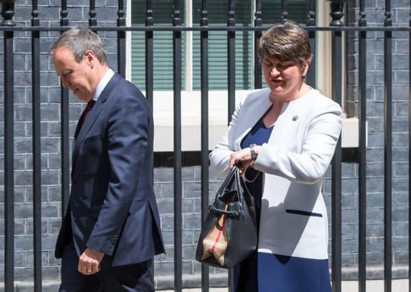 DUP leader Arlene Foster and deputy leader Nigel Dodds arriving at 10 Downing Street. Picture: Dominic Lipinski/PA Wire