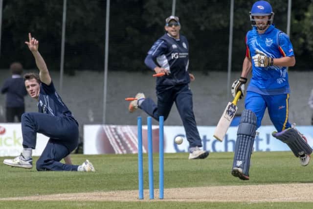Chris Sole, left,  sends the bails flying as he brilliantly runs out Namibias Jan Frylinck.