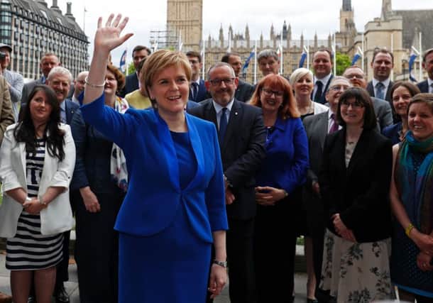 Nicola Sturgeon with the SNP's 35 MPs outside Westminster. Picture: Adrian Dennis/AFP
