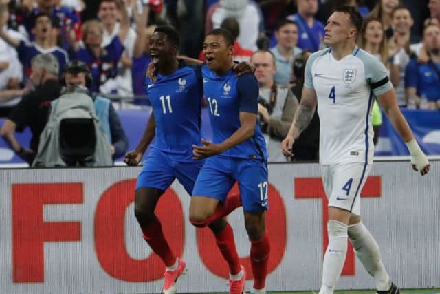 Ousmane Dembele, left, celebrates with team-mate Kylian Mbappe after scoring Frances winner. Picture: AFP/Getty.