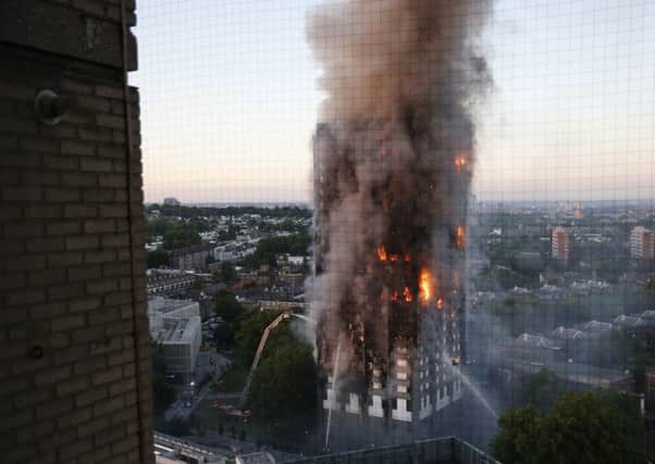 One neighbour said he believed someone had jumped from about 10 to 15 floors to escape the fire. Picture: SWNS