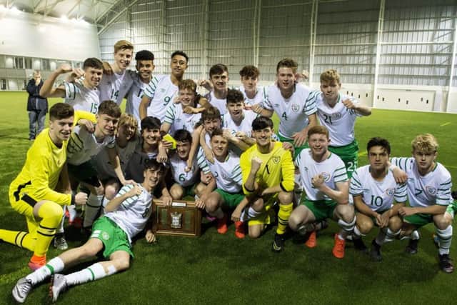 Barry Coffey (left, lying down) celebrates with his team-mates after Ireland defeat Scotland to lift the Victory Shield. Picture: SNS