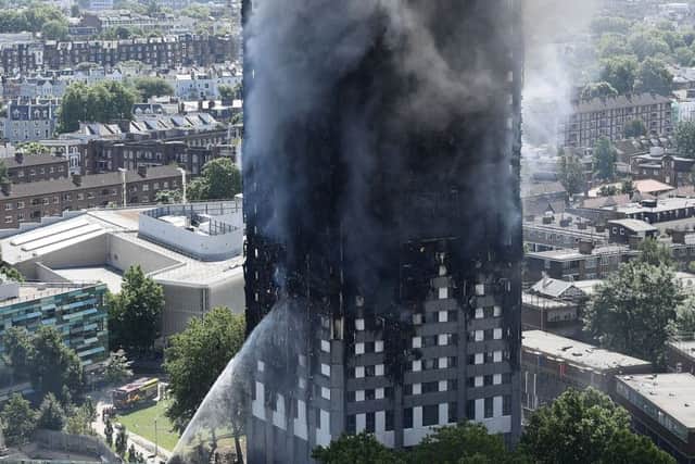 Firefighters drench the burning 24 storey residential Grenfell Tower block in Latimer Road, West London. Picture: Getty