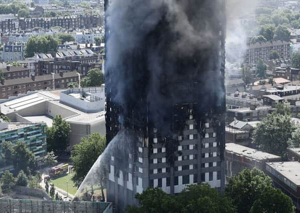 Firefighters drench the burning 24 storey residential Grenfell Tower block in Latimer Road, West London. Picture: Getty