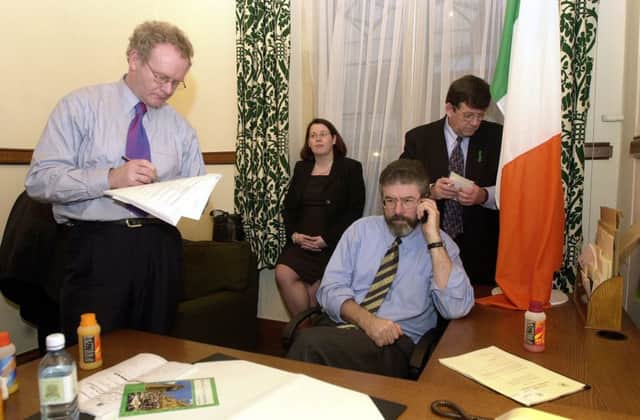 Sinn Fein President Gerry Adams pictured with the late  Martin McGuinness in 2002 at their House of Commons offices. Picture: PA