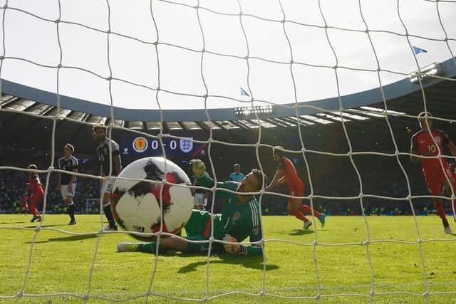 Scotland keeper Craig Gordon is beaten by Alex Oxlade-Chamberlain's 70th minute shot which put England in front at Hampden on Saturday. Picture: Getty