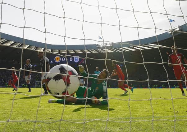 Scotland keeper Craig Gordon is beaten by Alex Oxlade-Chamberlain's 70th minute shot which put England in front at Hampden on Saturday. Picture: Getty