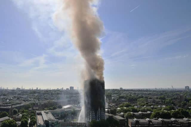 Smoke billows from a fire that has engulfed the 24-storey Grenfell Tower in west London.  Picture: Victoria Jones/PA Wire