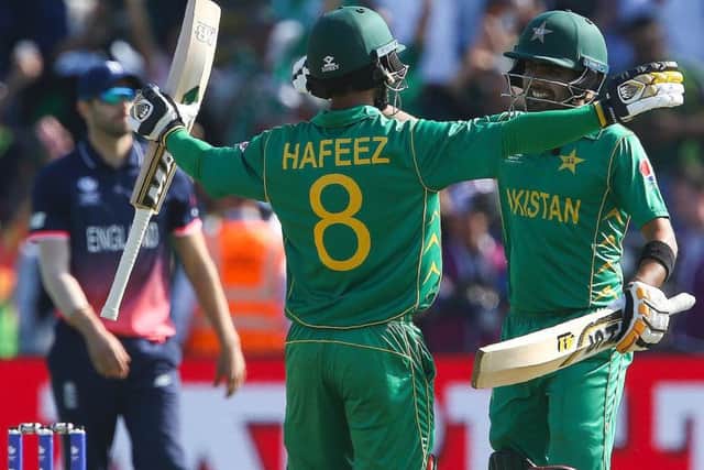 Pakistan's Mohammad Hafeez, left, and Babar Azam celebrate clinching the victory over England. Picture: Geoff Caddick/AFP/Getty