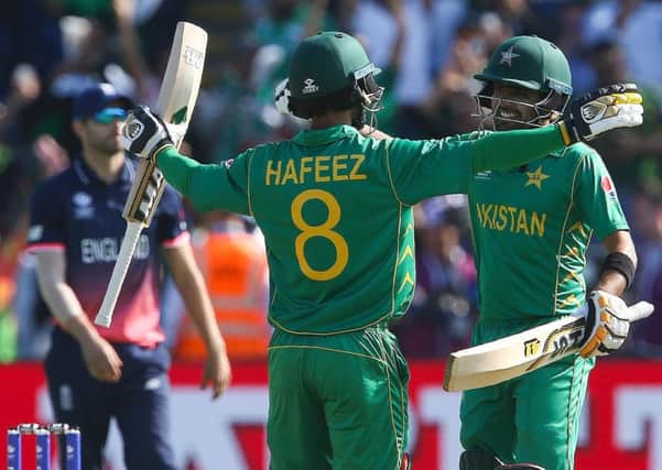Pakistan's Mohammad Hafeez, left, and Babar Azam celebrate clinching the victory over England. Picture: Geoff Caddick/AFP/Getty