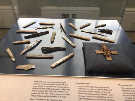 Around 70 objects from the Galloway Hoard have gone on display at the National Museum of Scotland.