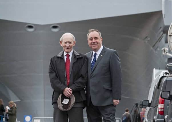 Robert Salmond with son Alex after the Queen Elizabeth II was officially named the Royal Navy's new aircraft carrier in 2014 (Chris Watt/Getty Images)