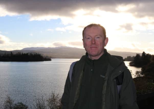 Debut novelist Charles E McGarry beside Loch Awe