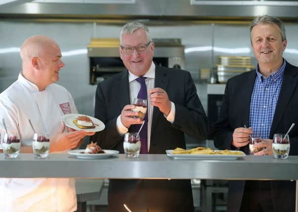 Fergus Ewing with John Quinn, Bidfood development chef for the north, left, and chief executive Andrew Selley. Picture: Neil Hanna